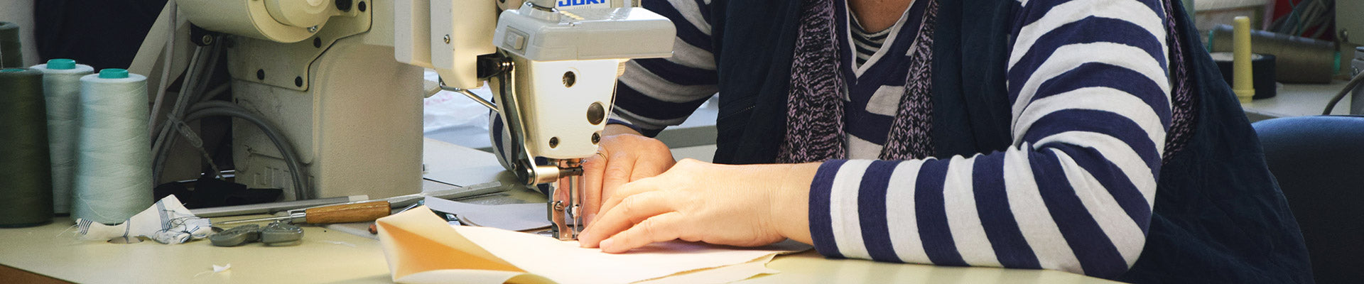 seamstress working on a sewing machine