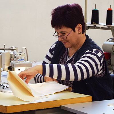 seamstress working on a sewing machine in a clothing factory in bulgaria