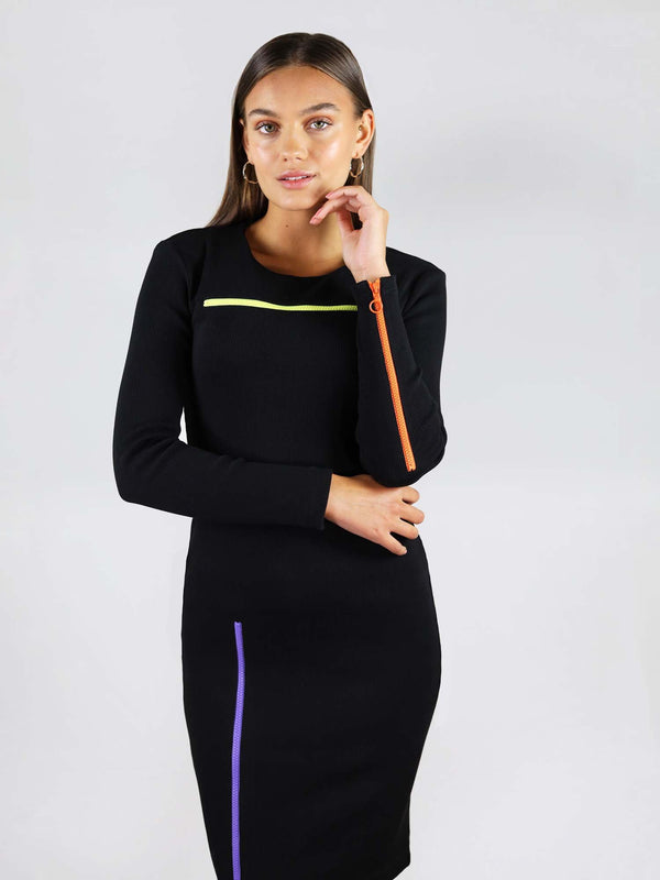 The wicked zipper dress has contrast colours and three zippers in neon green, orange and blue. It has tight body con fit and long sleeves.