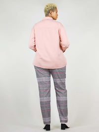 Back shot of the blushing pink, summer shirt. Lose fit around shoulders, hips, and waist for extra added comfort. Nicely roundly shaped around the hips, when worn over trousers.