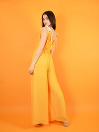 backshot of the eternal summer jumpsuit with adjustable shoulder straps for perfect comfort. design by blonde gone rogue.