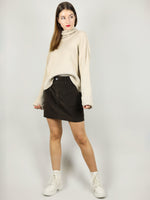 The turtleneck in beige is very cosy and made from 100% organic cotton. It is very comfortable with slightly loose fit and extra long roll neck and sleeves. 
