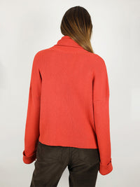Bright red colour and slightly loose fit, the turtleneck is perfect for winter time. It has extra long sleeves, long roll neck pullover and hips length. 