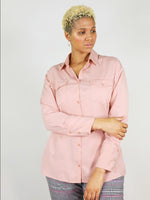 Buttoned up, summer shirt in blushing pink. Lose collar and comfortable fit around hips and waist with large front pockets and buttons around the wrist. 