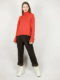 The red turtleneck has hips length and slightly loose, comfortable fit. Extra long sleeves for added warmth as well as long roll neck pullover. 