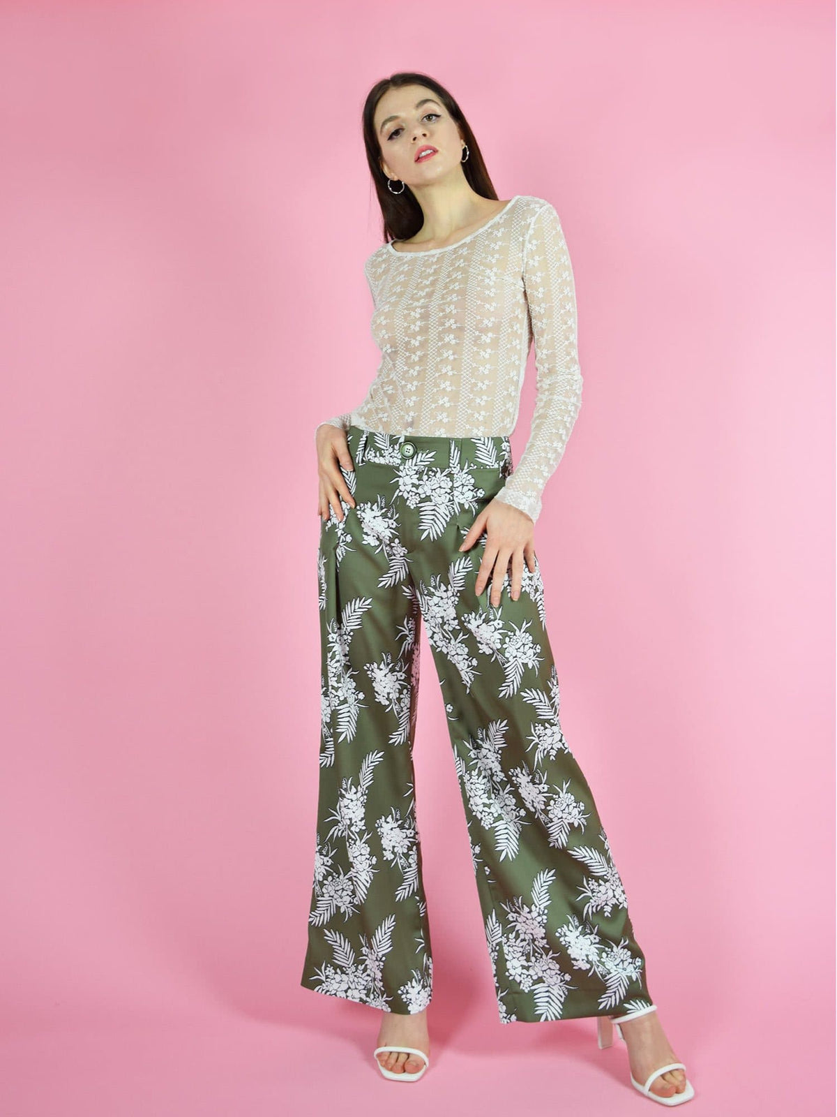 blonde gone rogue's girlboss green sustainable trousers have a wide leg, high-waist design. The pants are made from a beautiful, silky green fabric with white floral print. Paired with the daily long sleeve lace top.