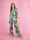 Front shot of the girlboss formal pant suit in green with white floral print. The trouser suit is made from an oversized, longline blazer and wide leg trousers made from sustainable materials.