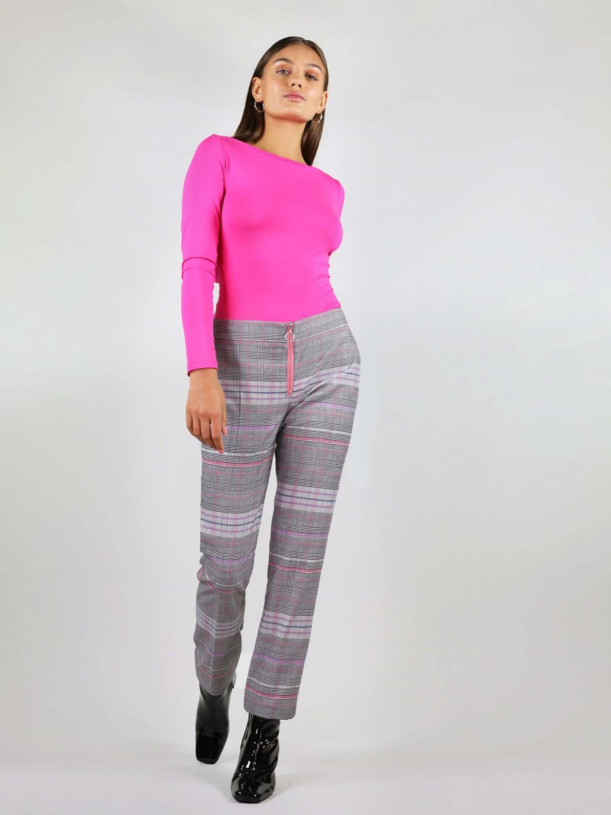 Pink, grey checker fabric and slim fit, the revivify trousers are made from up-cycled fabrics. They have extra details such as pink metal zip with ring puller at the front. 