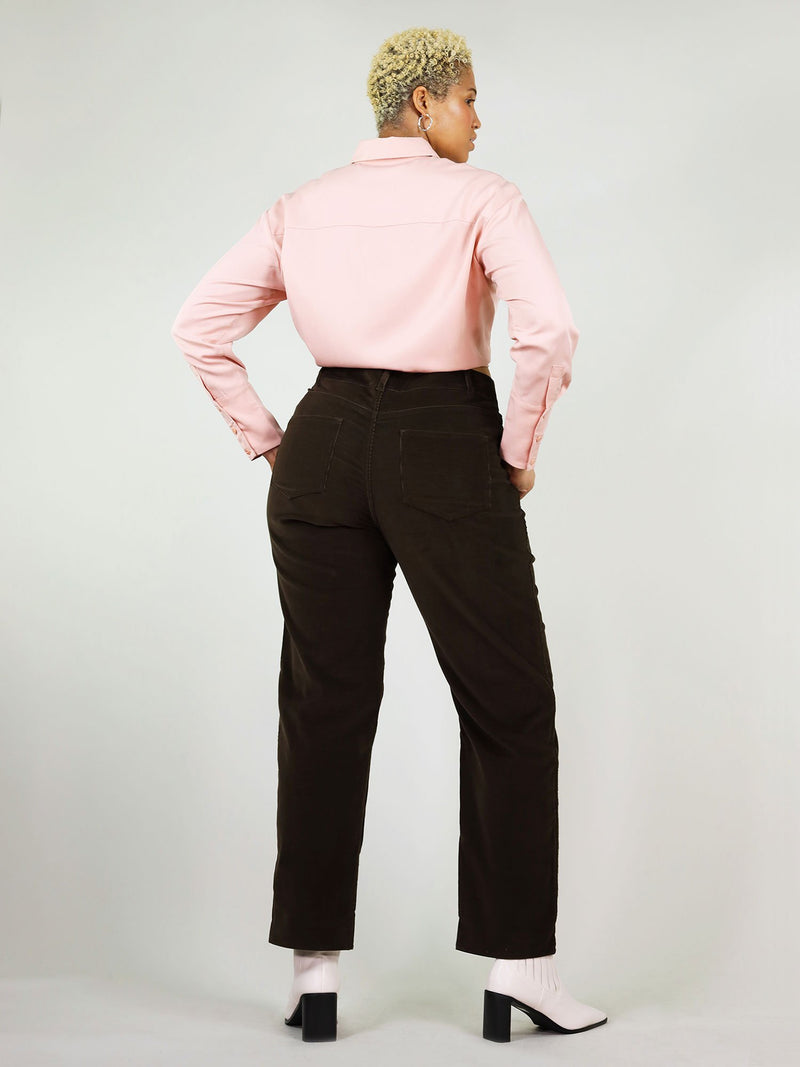 This is a backshot of the blushing pink summer shirt. It has comfortable fit around the shoulder, buttons down the arms and wrist, perfect to be tucked in. 