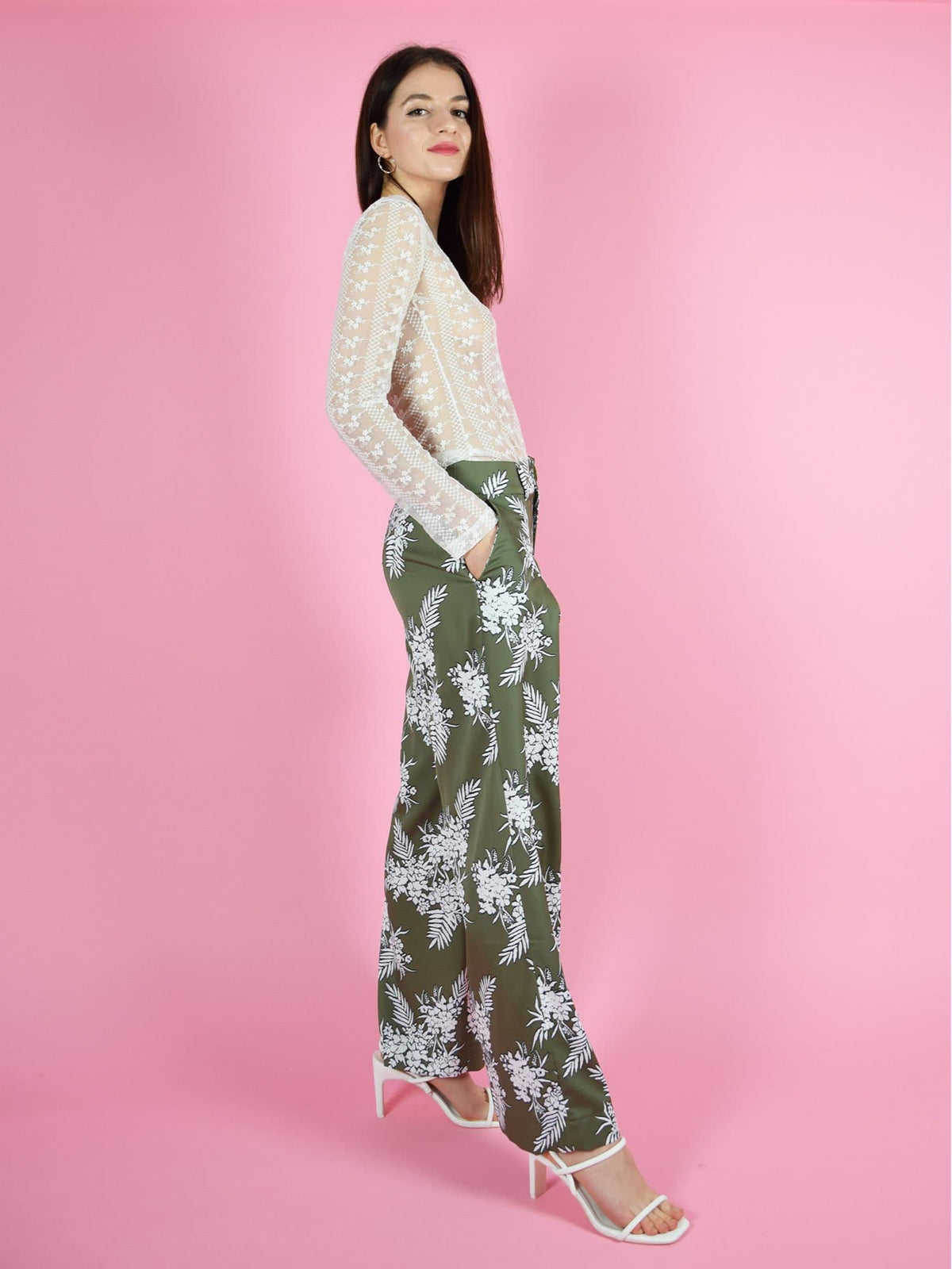 Side shot of blonde gone rogue's daily long sleeve lace top and girlboss wide leg sustainable trousers in green.