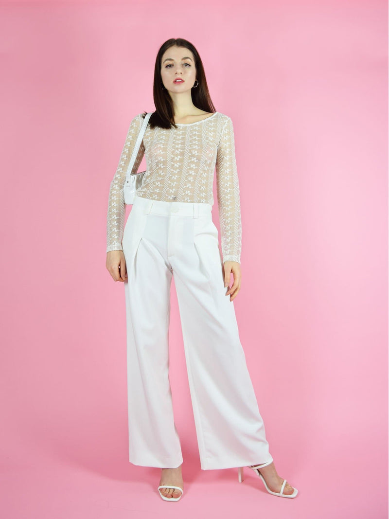 Frontshot of blonde gone rogue's daisy long-sleeve top and girlboss trousers in wide. The pants have a high-waist, wide leg design.