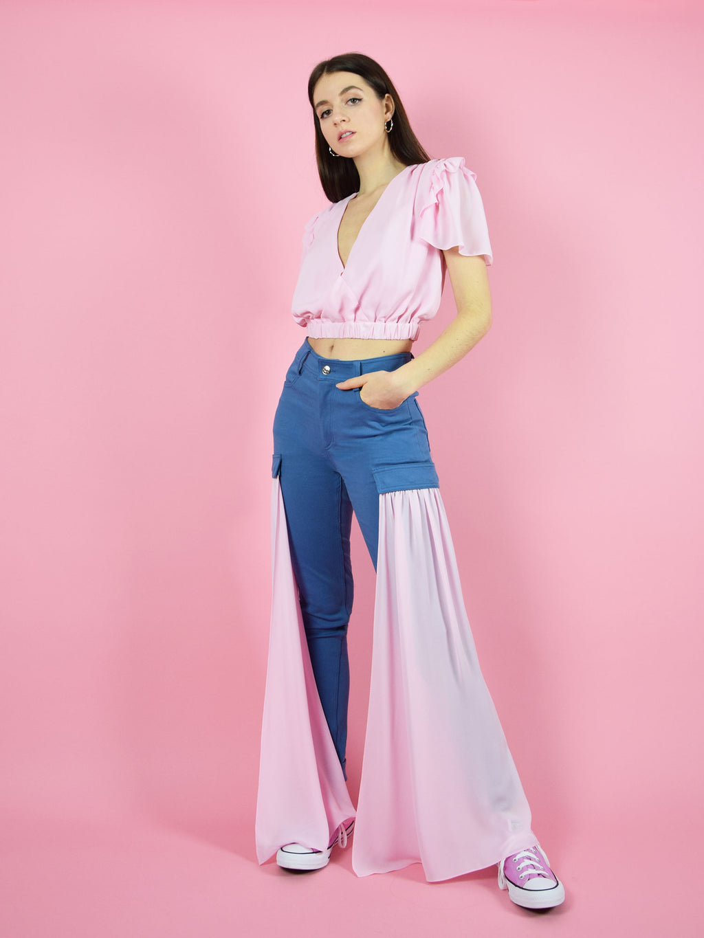 An amazing summer outfit by blonde gone rogue - the wildflower surplice crop top and the sustainable high-waisted skinny jeans with detachable veils on the side. They come in pink.