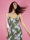 Close up of blonde gone rogue's floral slip dress in green.