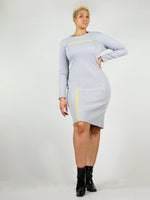 The wicked zip dress is grey has tight body con fit and under knee length. It has bright neon yellow zippers, one on the right leg and one under the collar bone area that can both unzip.