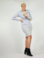 Bright yellow zippers on the right leg, left arm and under the collar bone that unzips, the wicked zipper dress in grey is an interesting dress with long sleeves and under knee length. 