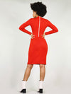 Back view of the wicked zipper dress in dress with tight body con fit and under knee length. Long sleeves as well as a white zip going from the neck down to the waist and can unzip. 