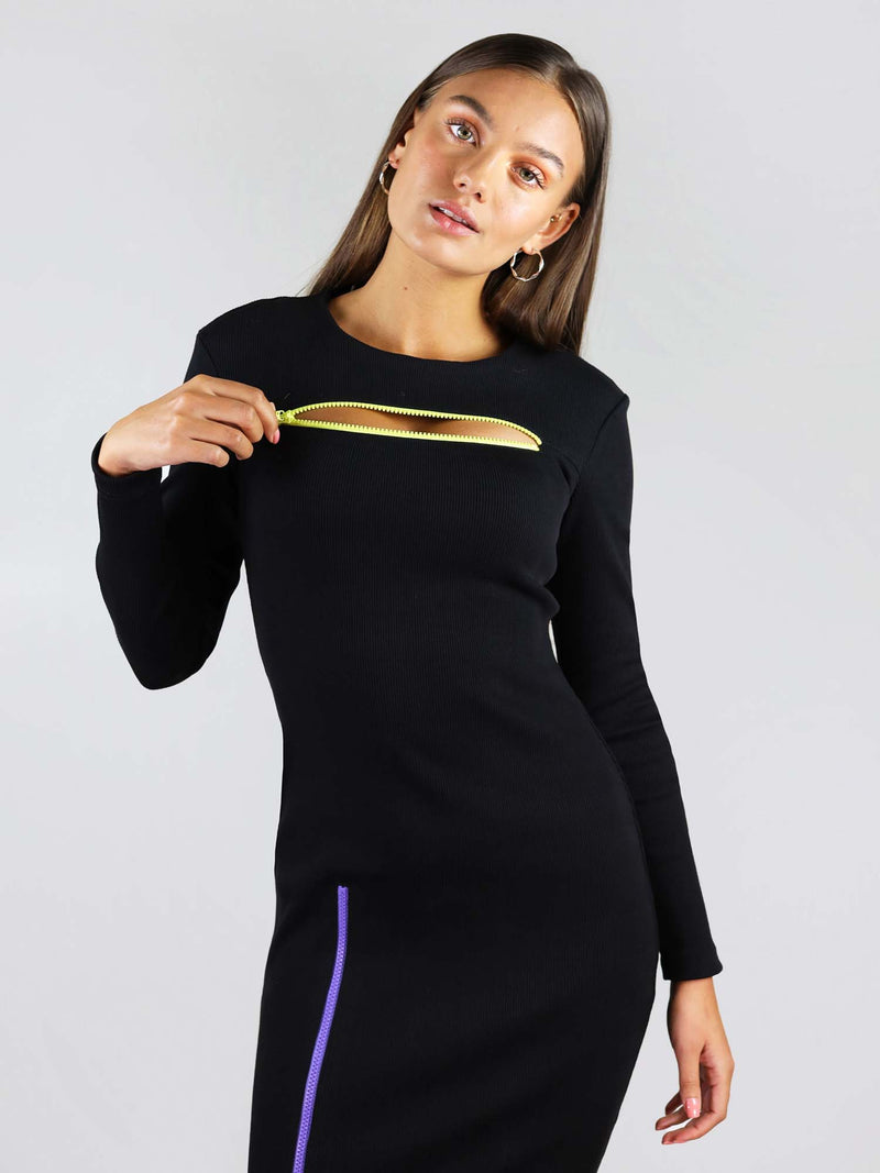 Yellow zip under the collar area, blue zip that can unzip and reveal the right leg. The wicked zipper dress comes in black and has long sleeves.