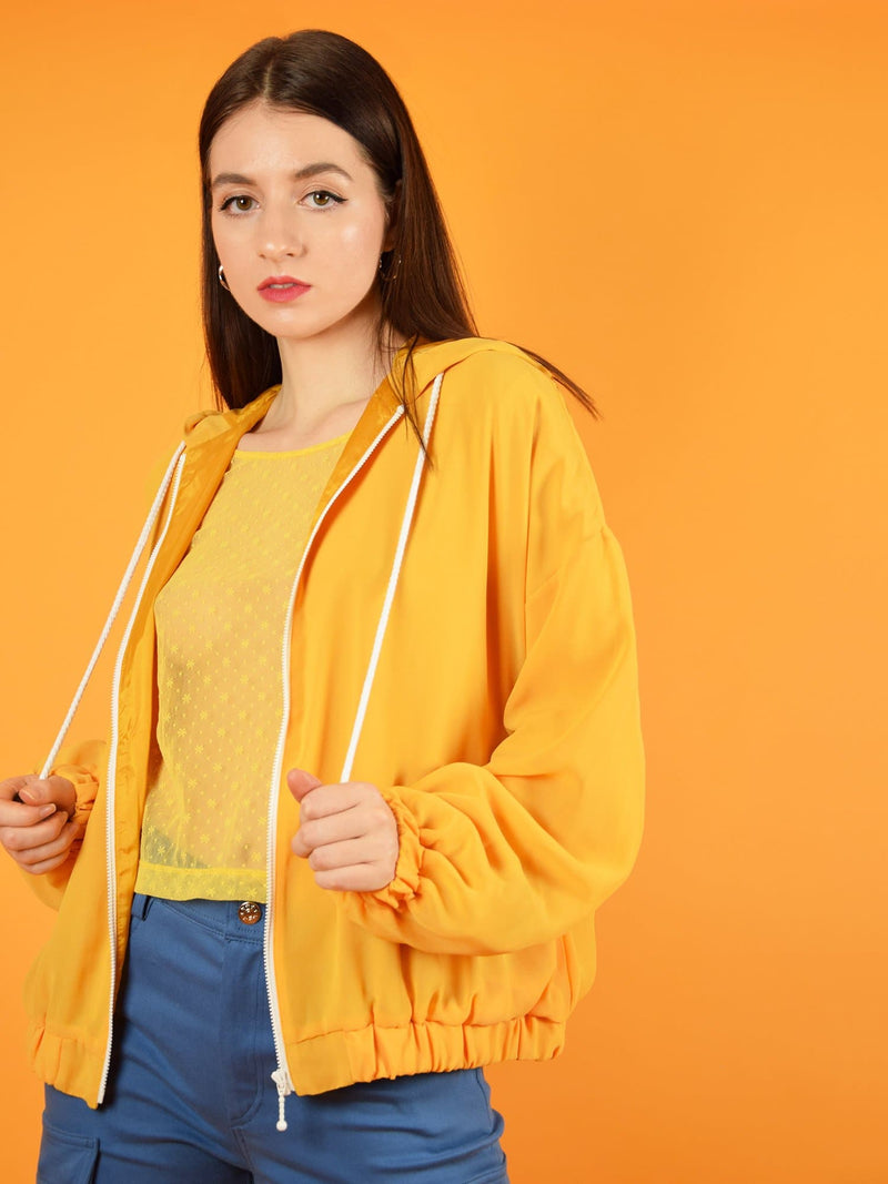 blonde gone rogue's bonfire sustainable bomber jacket in orange. The jacket has a loose, comfortable fit and is perfect for spring, autumn and chilly summer evenings. 
