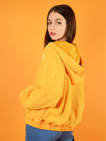 Backshot of the bonfire sustainable bomber jacket by blonde gone rogue. The jacket features a hood and two slit pockets and is made from 100% up-cycled, sustainable materials.