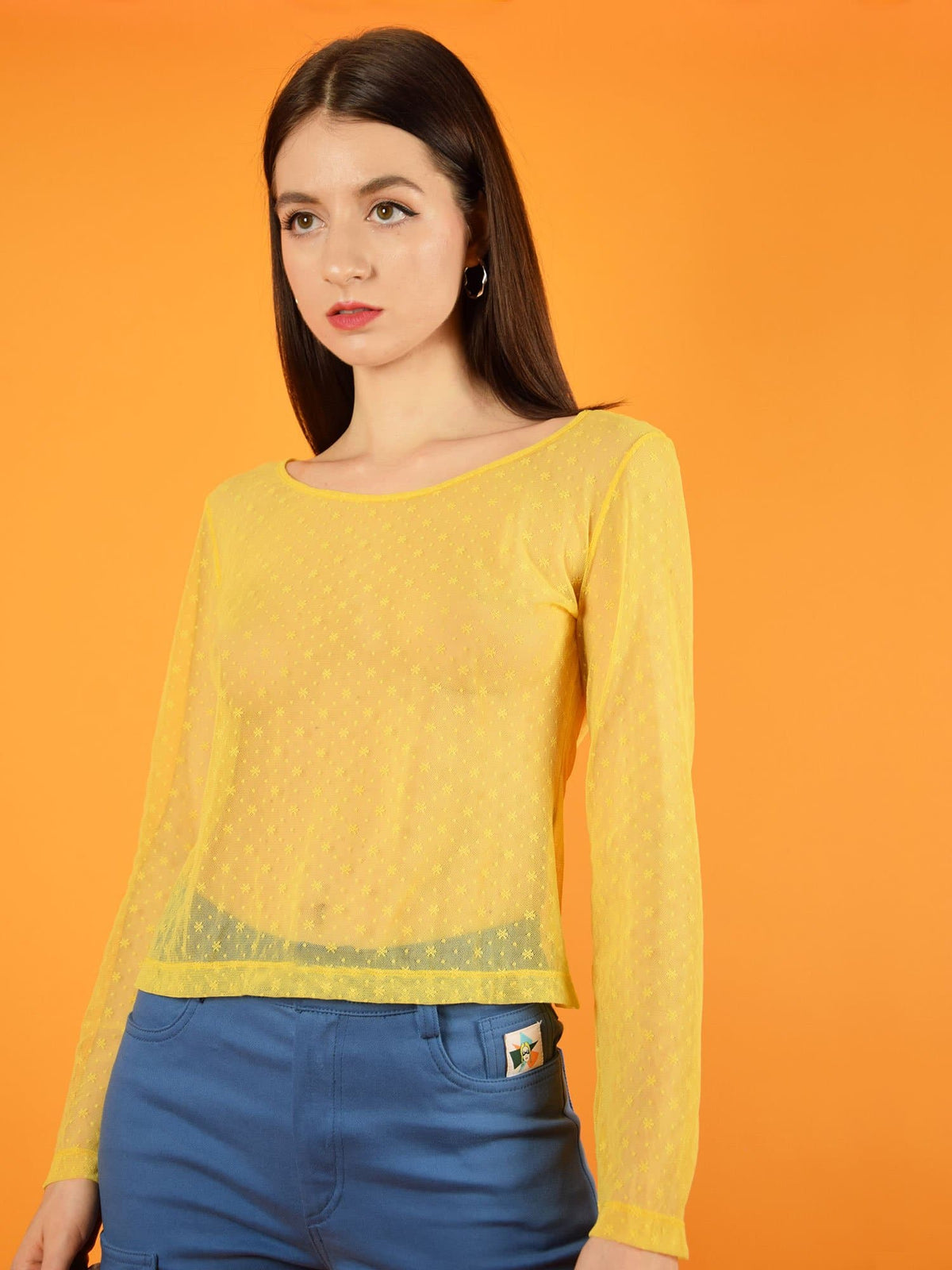 The yellow lace top with long sleeves is a cool match with high-waisted skinny jeans. It is slightly transparent and has a beautiful floral lace. designed by blonde gone rogue