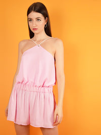 The desert dreams playsuit in pink is a summer jumpsuit with a short silhouette, loose fit and adjustable shoulder straps for a perfect fit.