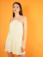 The desert dreams playsuit in white lace is a short, summer jumpsuit from white lace. It is semi backless and has a loose, comfortable fit.