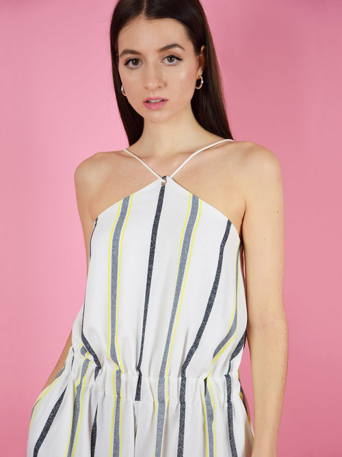 Close up of the desert dreams playsuit in white stripe. The adjustable shoulder straps guarantee perfect fit. The short summer jumpsuit is designed by blonde gone rogue.