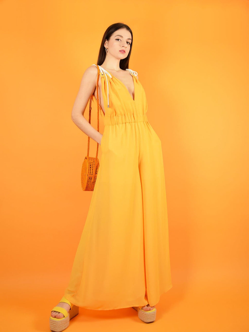 the sustainable eternal summer jumpsuit in orange - wide leg dressy jumpsuit for weddings and formal occasions. design by blonde gone rogue.