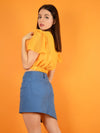 Backshot of the lace up denim skirt and the wildflower orange surplice top by blonde gone rogue.